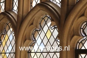 Stained glass windows in Fitzalan Chapel, a 14th century chapel belonging to Arundel Castle, home of the Dukes of Norfolk. West Sussex, England, UK.